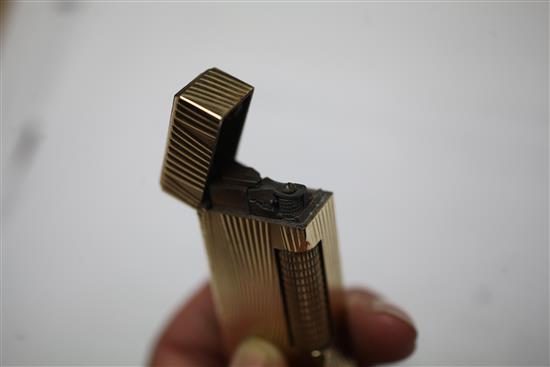 A 1960s 9ct gold Dunhill lighter, approx. 2.5in.